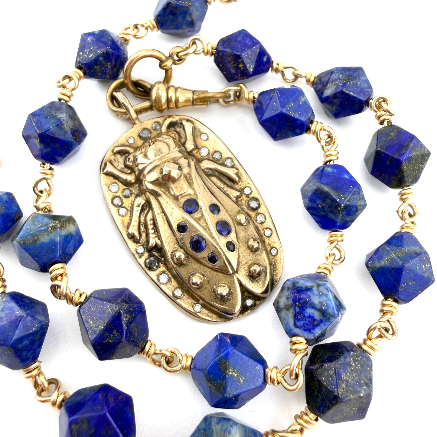 
                  
                    CICADA Luxe Necklace 29 Blue Sapphires and Diamonds on Lapis Lazuli
                  
                