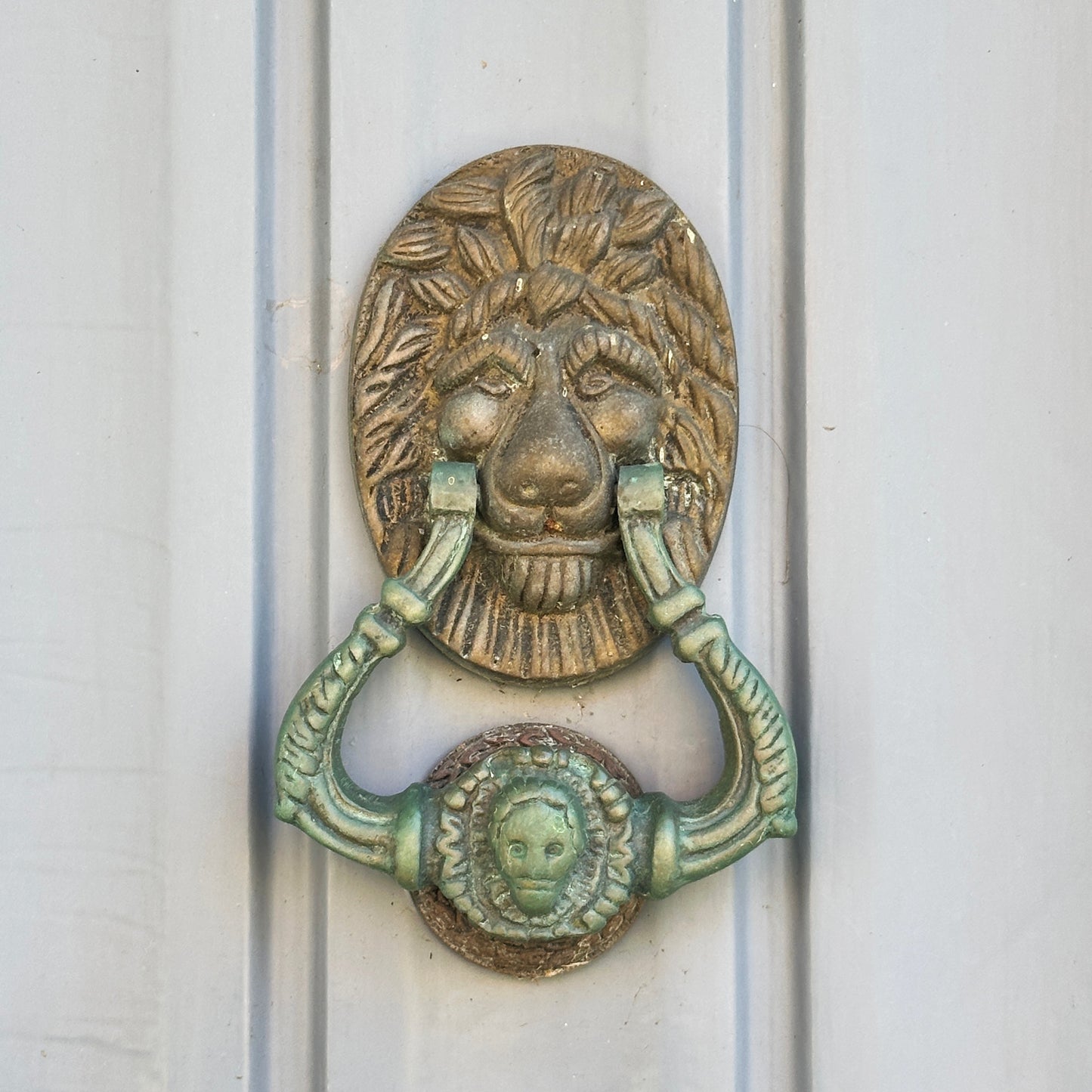 
                  
                    Lion Door Knocker Earrings in Bronze with Onyx and Pyrite
                  
                