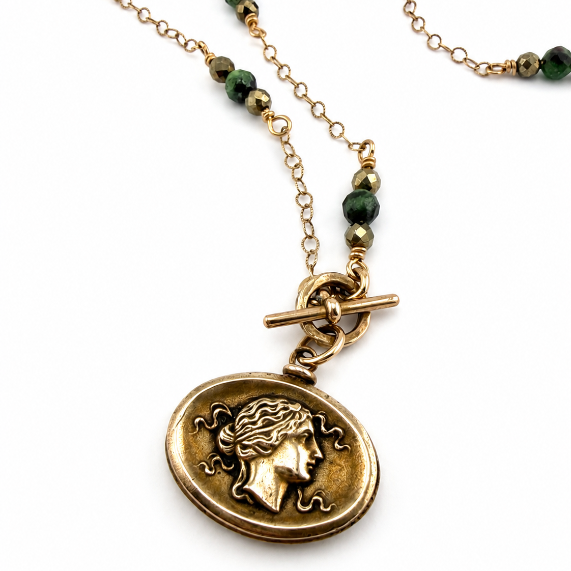 
                  
                    SELENE Intaglio Necklace - Bronze with Ruby Zoisite and Pyrite
                  
                