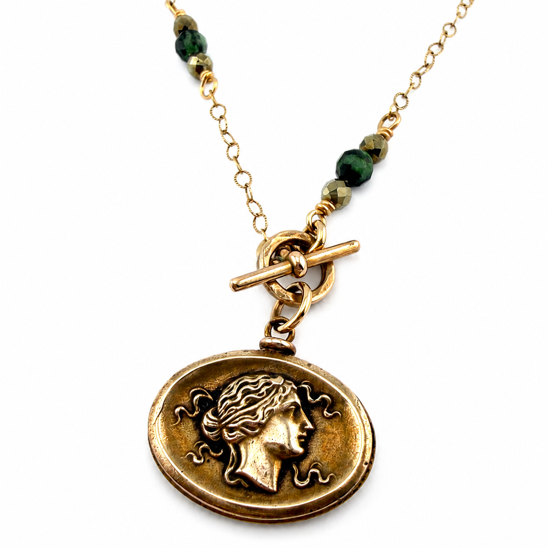 
                  
                    SELENE Intaglio Necklace - Bronze with Ruby Zoisite and Pyrite
                  
                