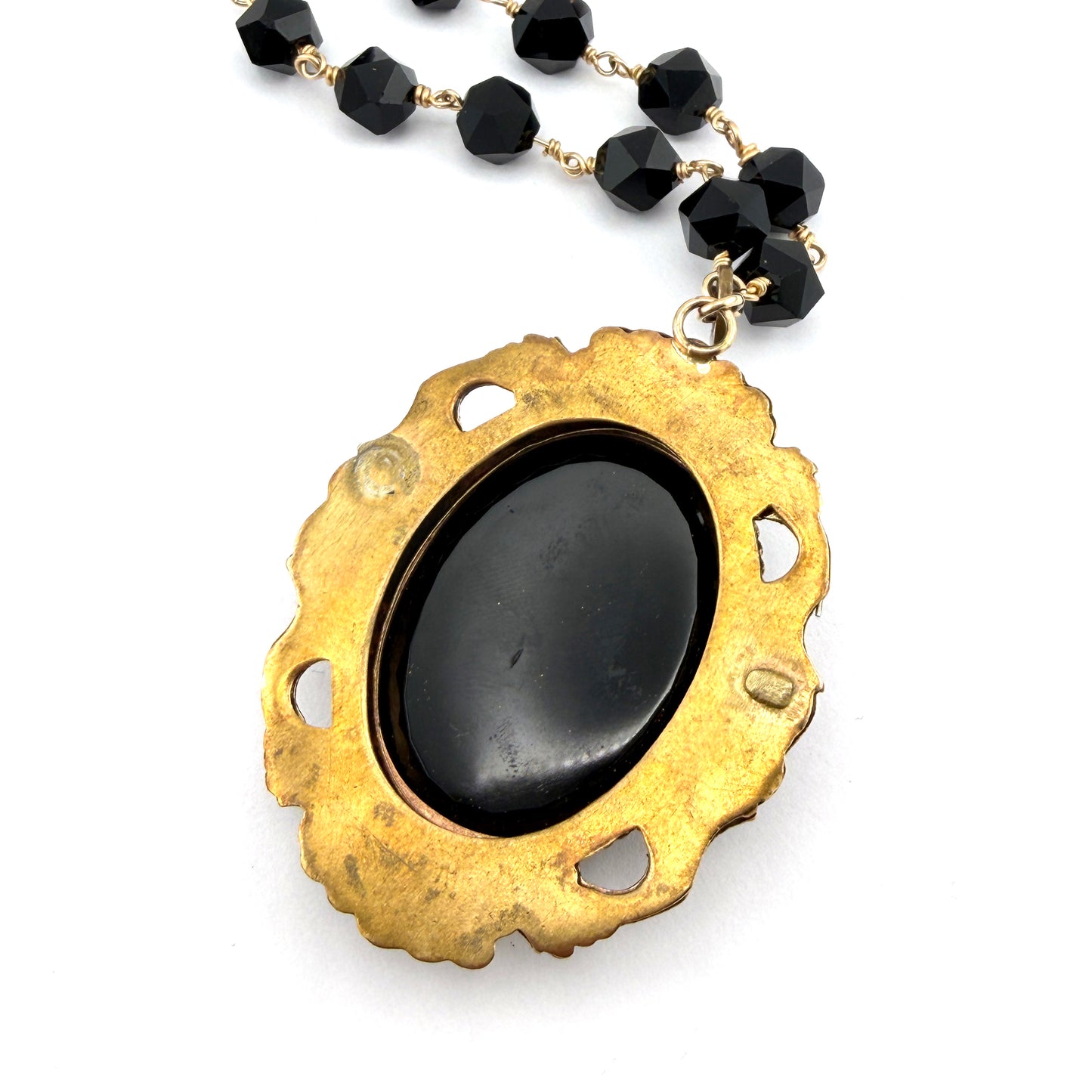 
                  
                    Antique Black Cameo with Star Cut Onyx
                  
                