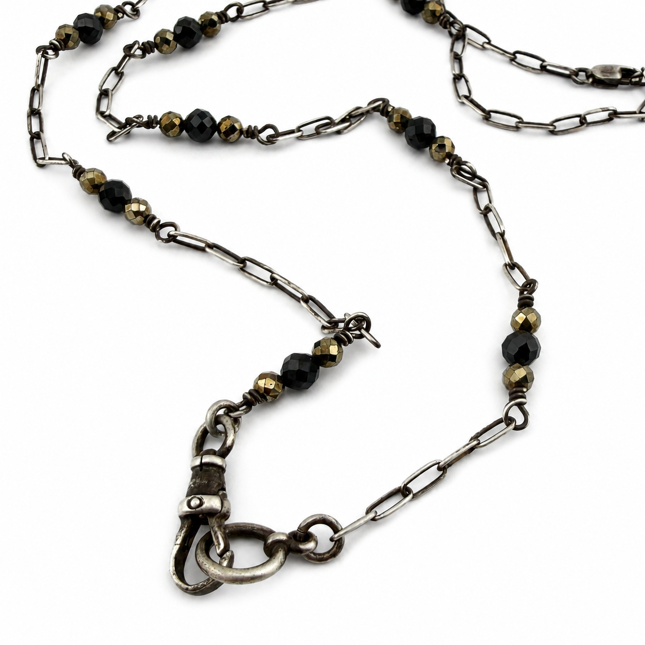 
                  
                    Collector's Charm Keeper Necklace: Black Spinel & Pyrite in Silver
                  
                
