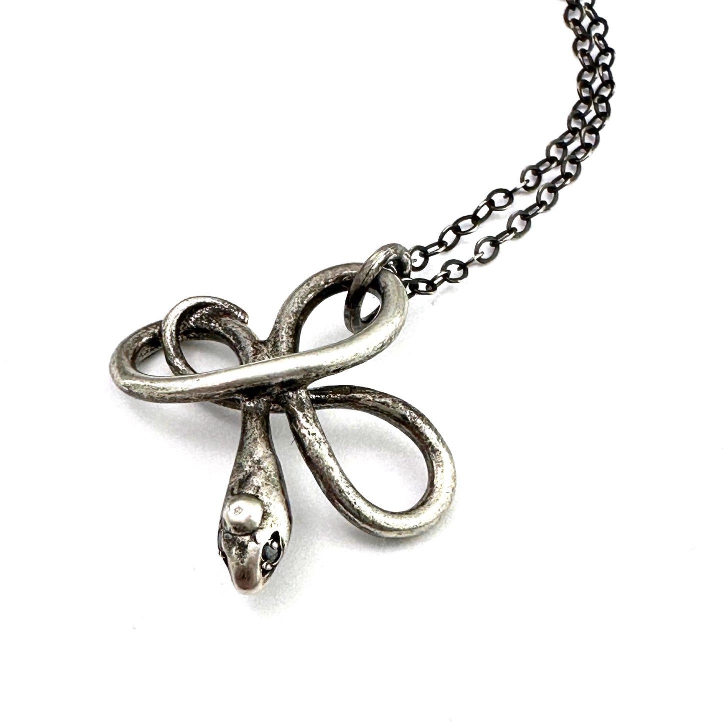 
                  
                    Black Diamond Eyes Serpent Necklace - Silver
                  
                