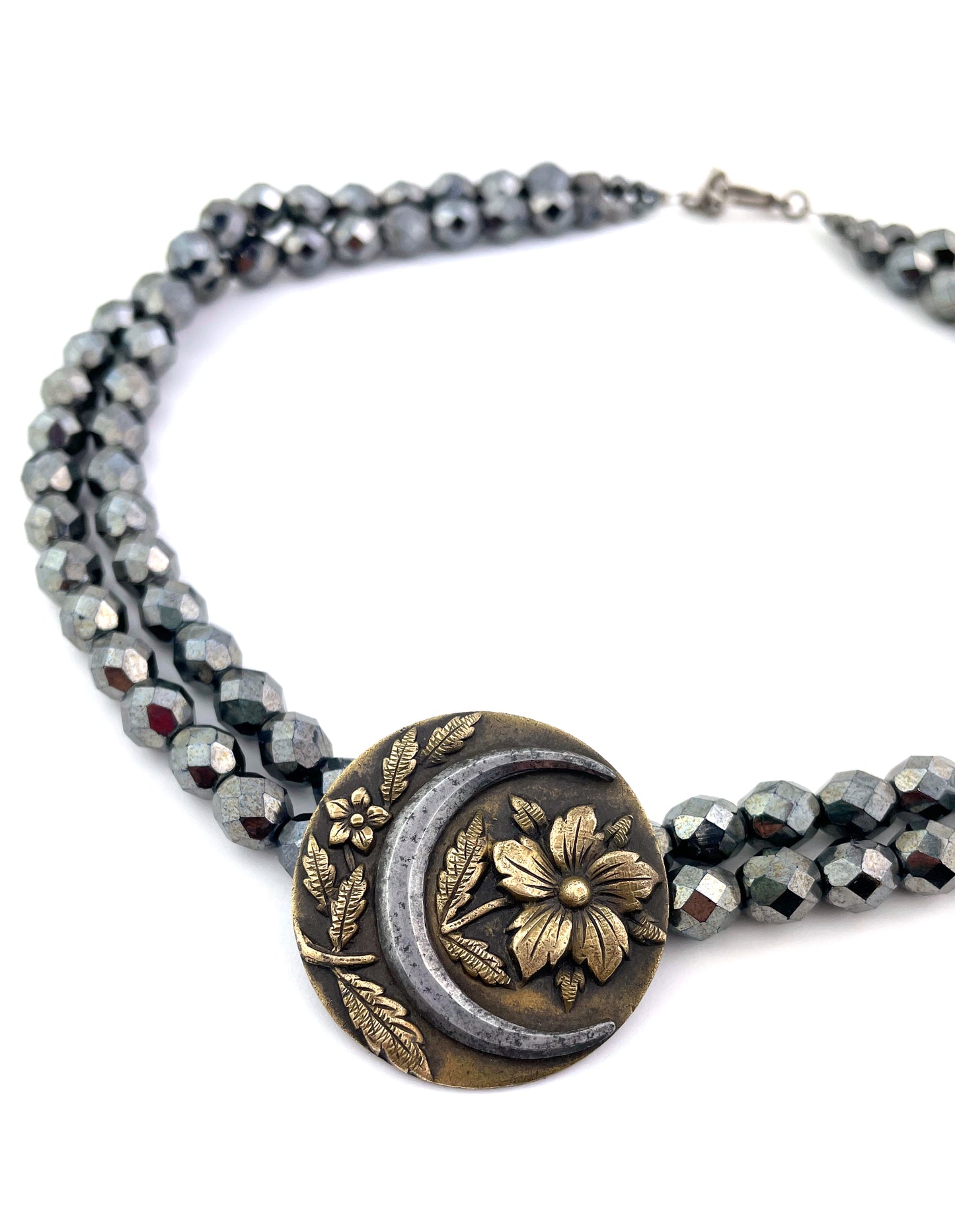 
                  
                    MOON BLOSSOM Cut Steel Necklace
                  
                