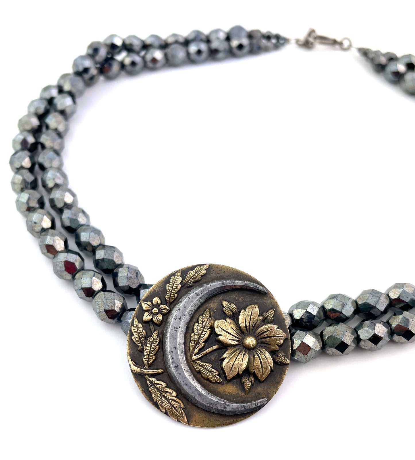 
                  
                    MOON BLOSSOM Cut Steel Necklace
                  
                